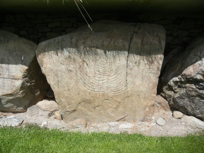 a rock with a face carved into it